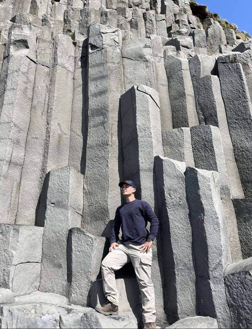 Jacob Dunwoody standing in front of a rock formation